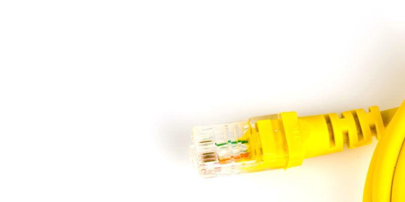 Yellow network cable  on white .